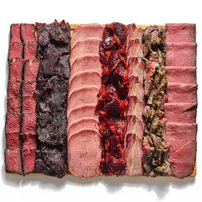 Next Level Taste Chef Special Board with sliced kosher deli meats, white background