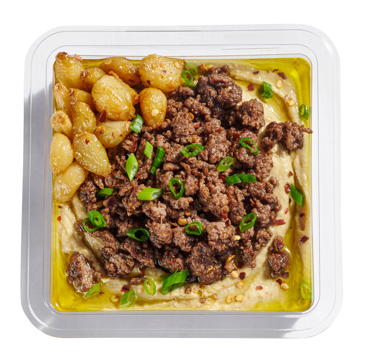 Next Level Taste Chummus Basar close up with confit garlic and ground beef, kosher, white background