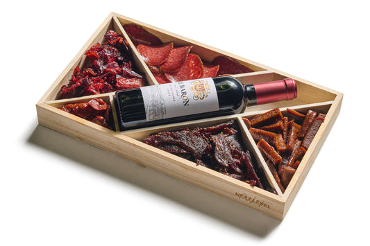 Next Level Taste Munch Board gift box with wine and cured kosher meats, white background